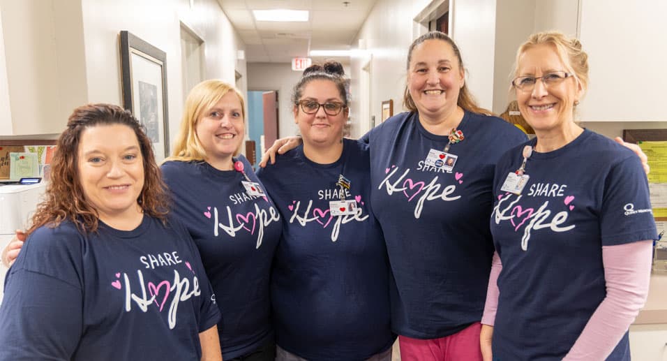 QMG-Team-Share-Hope-Shirts Quincy Medical Group Employees with matching shirts that say share hope