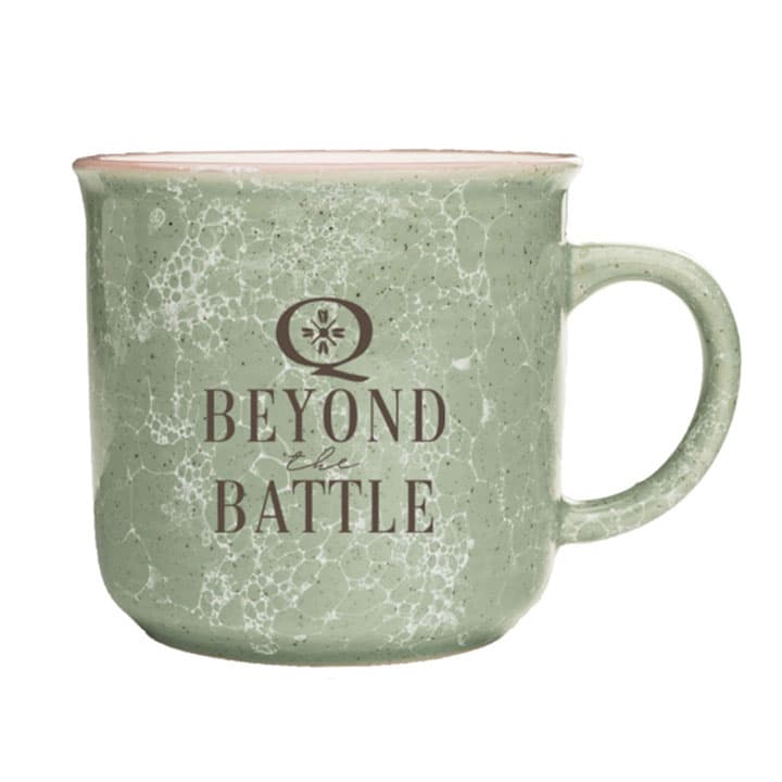 Green marbled coffee mug that says Beyond the Mug